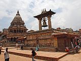 Kathmandu Patan Durbar Square 03 Krishna Temple and Taleju Bell The Krishna Temple (1723) is the octagonal white stone temple as you enter Patan�s Durbar Square from the south. The large bell hanging between two pillars on the right is Taleju Bell (1736).
